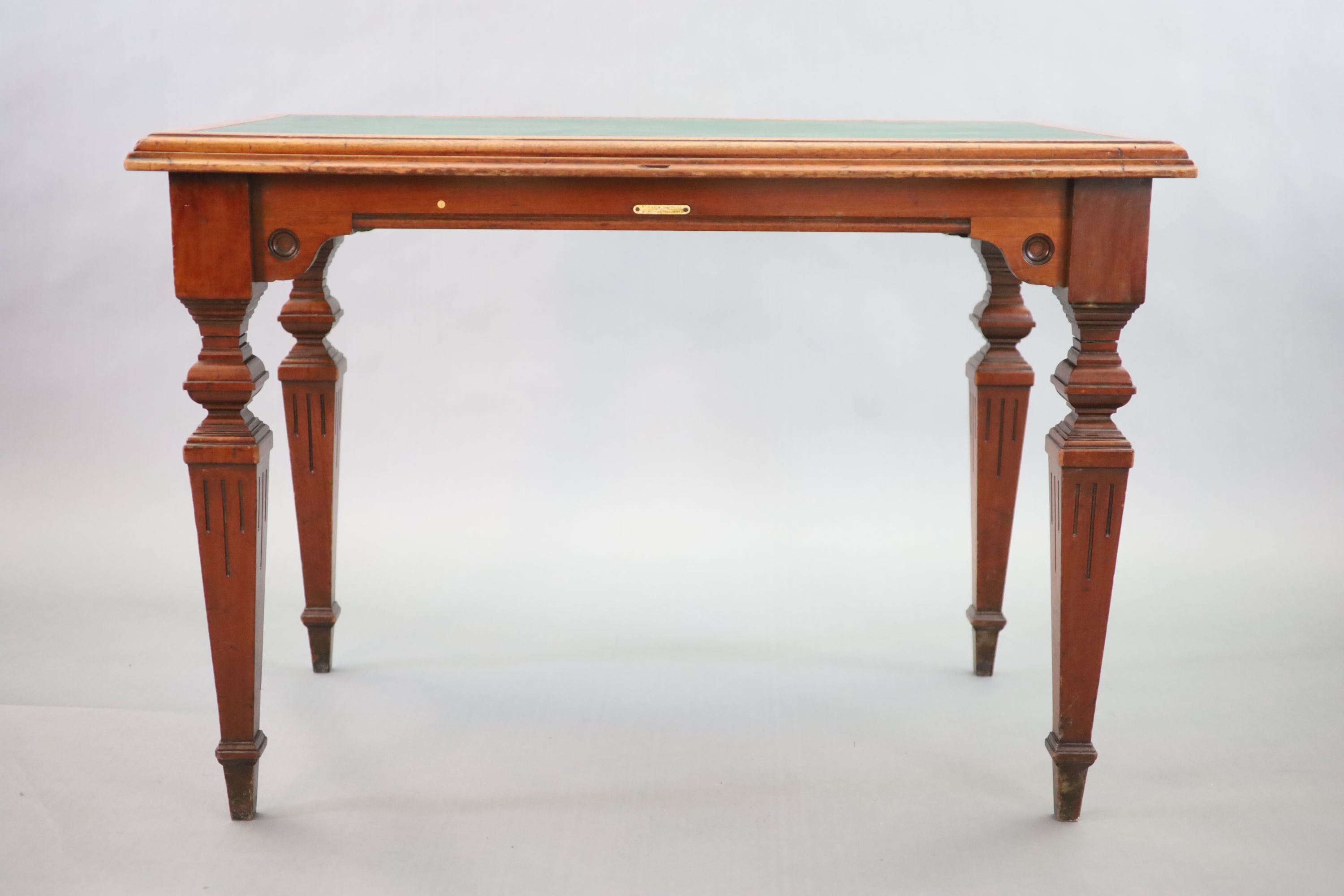 A Victorian mahogany library table, supplied by Sage & Co. Shopfitters of London, W.113cm D.69cm H.78cm